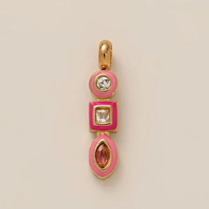 Detail of gold pendant with tiered pink enamel and sparkling zircon gemstones