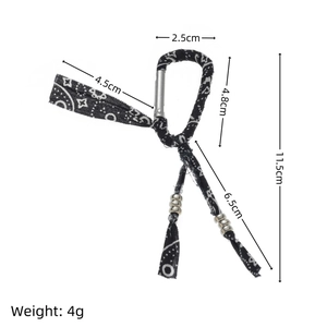 Ethnic paisley fabric keychain with silver metal beads and hooks on a white background