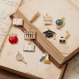 11-piece gold school theme charms set including globes and pencils for DIY necklaces