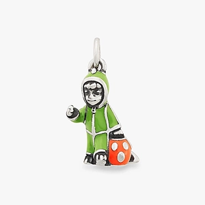 Macro shot of a Halloween charm featuring a figure in green suit with an orange pumpkin bucket