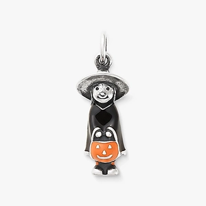 Detail of Halloween witch charm with orange pumpkin bucket and black enamel finish