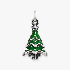 Macro detail of Christmas tree pendant with green enamel and silver steel finish