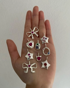 Detailed close-up of Y2K style silver steel pendants with colorful zircon gemstones