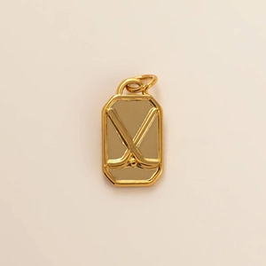 Octagon stainless steel pendant in golden finish with embossed ice hockey sticks and puck