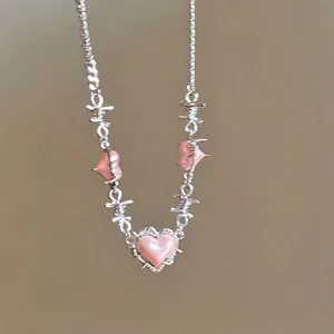 Pink heart pendant necklace with silver barbed wire design in aesthetic sweet-cool style