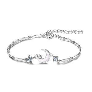 Elegant silver moon and star bracelet with white shell pendant and sparkling zircon stones