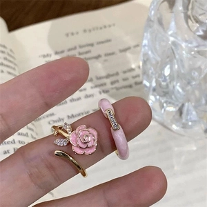 Chic pink enamel camellia and gold rhinestone open ring set for women on hand