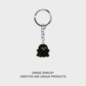Cute black and white ghost keychain with gold edges and zinc alloy ring for backpacks