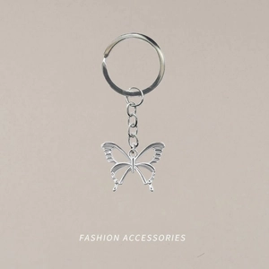 Minimalist silver hollow butterfly keychain with elegant metal wings for bags