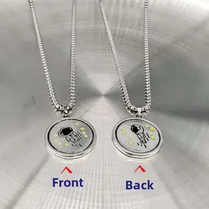 Titanium steel rotating astronaut necklace with double-sided celestial pendant design