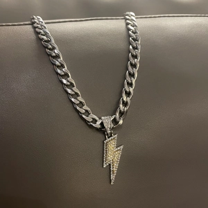 Mens hip hop lightning pendant on silver Cuban chain with sparkling yellow and white zircons