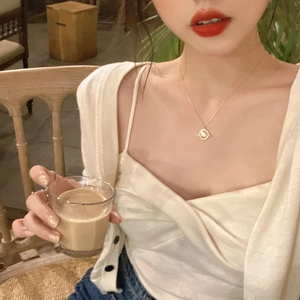 Elegant gold titanium steel planet necklace with white opal stone shown on model