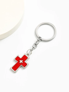 Macro detail of red enamel double cross keychain with sturdy silver alloy ring