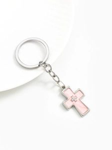 Detail of silver alloy double cross keychain with pink enamel inlay and metal link chain