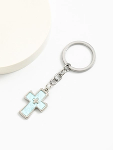 Close-up of double cross keychain with blue marble resin inlay and silver metal chain