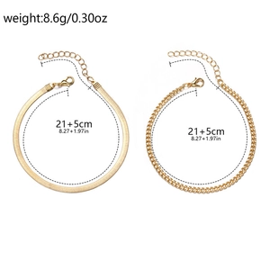 Detail showing gold tone curb and snake chain anklet with size and weight specs