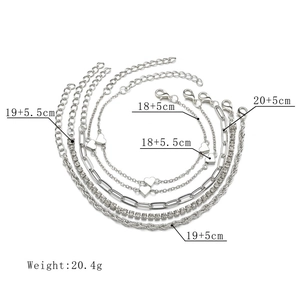 Detail showing set of 6 silver chain bracelets with heart charms and size dimensions