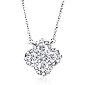 Close-up of silver four-leaf clover pendant with sparkling pear-cut cubic zirconia stones