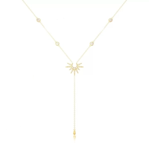 Elegant gold Y-shaped necklace featuring sunburst pendant and drop charm on white background