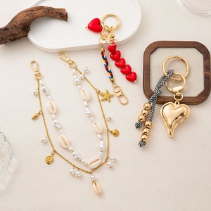 Vintage elegant charm pendants with gold starfish shell and heart details for handbags