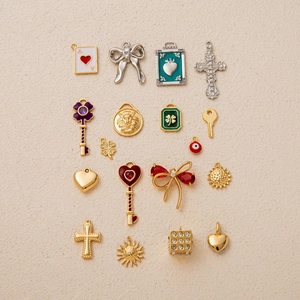 Assorted 18K gold plated charms with hearts, crosses and bows for DIY jewelry making