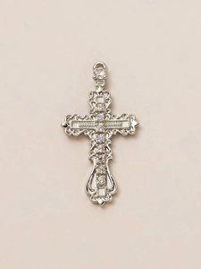 Close-up of vintage silver cross pendant with 18K plating and sparkling zircon stones