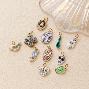 Various handmade colorful ceramic skull and bird pendants with 18K gold plated metal rings