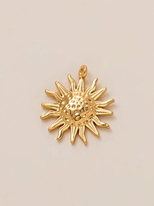 Detailed view of 18K gold plated sun pendant with textured center and wavy rays
