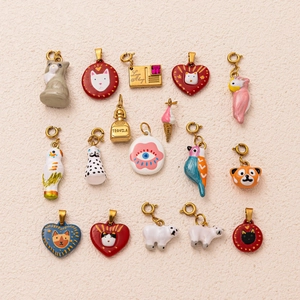 Detailed assortment of colorful enamel animal and heart charms with gold plating