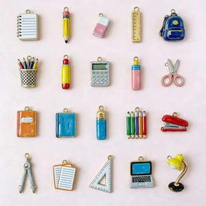 Set of 20 colorful school themed enamel pendants including pencils and notebooks