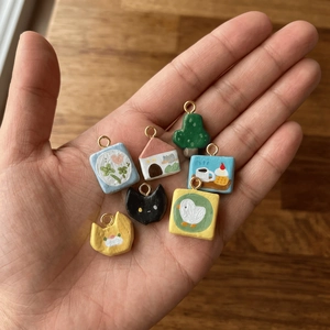 Colorful handmade clay pendants with 18K gold-plated rings in cat and flower shapes