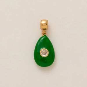 Detailed close-up of a green teardrop-shaped pendant with gold accents and a white zircon