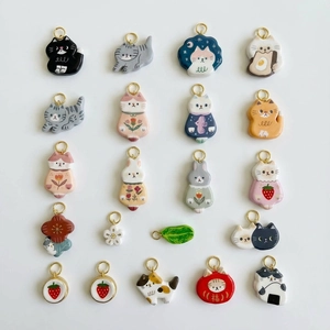 DIY cat and floral charm collection in pastel resin with gold loops for necklaces