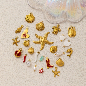 DIY gold stainless steel ocean pendants featuring starfish, shells, and colorful charms