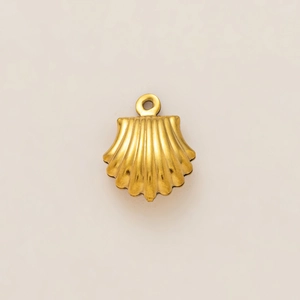 Detailed view of a gold-plated shell pendant with a textured brushed metallic finish