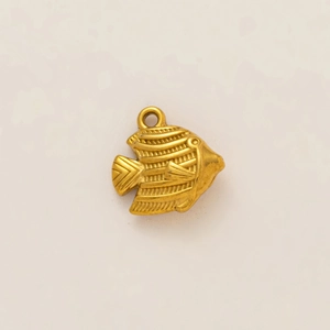 Macro detail of a 18k gold plated stainless steel tropical fish pendant accessory