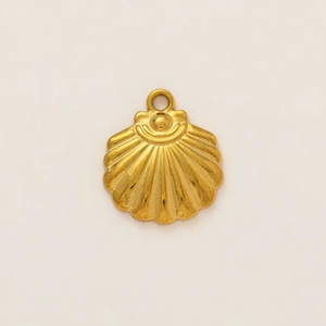 Macro detail of 18k gold plated stainless steel seashell pendant with ribbed texture