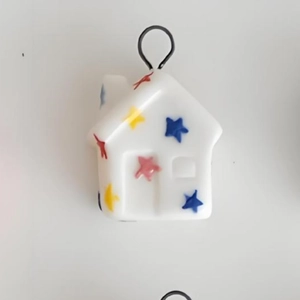 Polished 18K gold-plated stainless steel house-shaped pendant with colorful stars