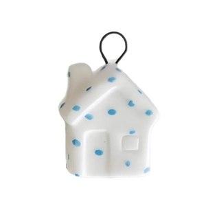 Minimalist white ceramic house pendant with blue dots and black hanging loop for decor