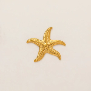 Macro detail of starfish charm with 18k gold plating and realistic bionic texture