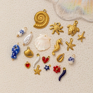 Blue ocean charms set with seahorse and starfish in 18k gold plated stainless steel