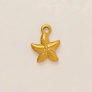 Close-up of 18k gold starfish pendant with textured grain surface for DIY jewelry
