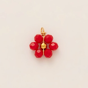 Detailed view of handmade flower pendant with red faceted beads and 18k gold plating