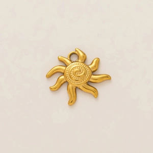 Detailed view of 18k gold plated sun pendant with spiral texture and wavy rays
