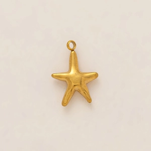 Detailed macro view of gold-plated starfish pendant with a textured matte finish surface