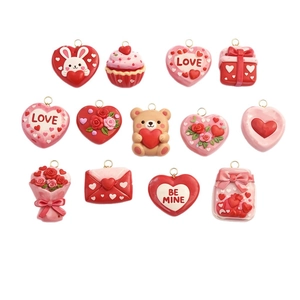 Set of 13 romantic Valentine resin charms with gold plating including hearts and cakes