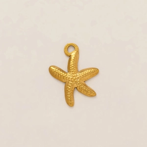 Macro detail of gold starfish pendant with textured beads and 18k vacuum plating finish