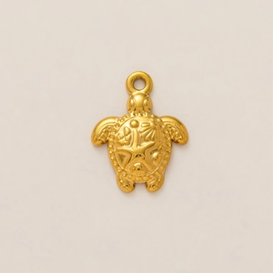 Detailed view of 18k gold plated sea turtle pendant with starfish and shell textures