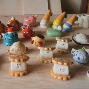 Cute anthropomorphic ceramic food charms featuring biscuit and mushroom designs
