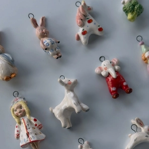 Handcrafted stainless steel animal pendants with colorful enamel featuring rabbit and swan